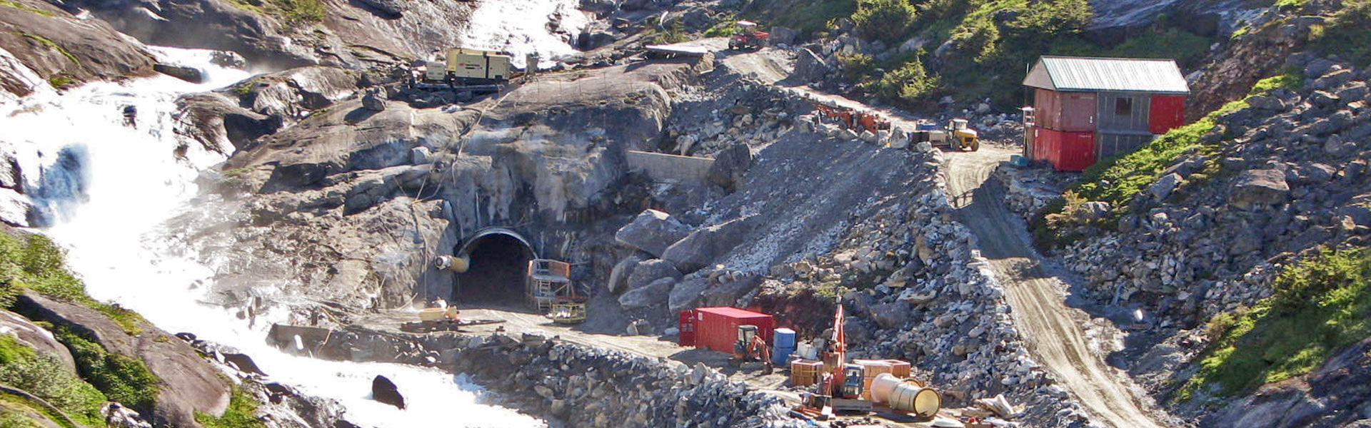 The Norwegian Lake Tap Method was successfully used to tap into the side of Lake Dorothy to allow the construction of a downstream dam. Challenges include thirty-degree, snow-covered mountainsides and limited access by helicopter.